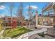 Backyard featuring a patio, playground and mature trees at 11465 W Atlantic Ave, Lakewood, CO 80227