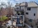 Stunning backyard featuring multi-level decks, a patio area, and lush landscaping, ideal for outdoor living at 11465 W Atlantic Ave, Lakewood, CO 80227