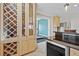 Open bar and wine storage that leads into an exercise room at 11465 W Atlantic Ave, Lakewood, CO 80227