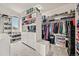 Spacious walk-in closet with custom shelving, ample storage, and natural light at 11465 W Atlantic Ave, Lakewood, CO 80227