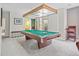 Bright game room with a green felted pool table and light fixture at 11465 W Atlantic Ave, Lakewood, CO 80227