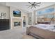 Spacious main bedroom with a fireplace, a large window, and a seating area, perfect for relaxing at 11465 W Atlantic Ave, Lakewood, CO 80227