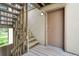 Exterior entry featuring a wood staircase leading to a private door at 2525 S Dayton Way # 1510, Denver, CO 80231