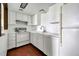 Bright kitchen featuring white appliances and tile flooring at 2525 S Dayton Way # 1510, Denver, CO 80231