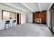 Open living room with fireplace, bar seating, and sliding glass doors at 2525 S Dayton Way # 1510, Denver, CO 80231
