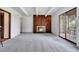 Living room with fireplace and sliding glass doors leading to a patio at 2525 S Dayton Way # 1510, Denver, CO 80231