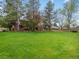 Lush green backyard and trees offering a serene and private outdoor space at 5845 W Portland Dr, Littleton, CO 80128