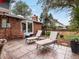 A cozy patio area furnished with lounge chairs offers a relaxing outdoor retreat at 5845 W Portland Dr, Littleton, CO 80128
