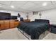 Finished basement with comfortable bedroom area and recreational space at 5845 W Portland Dr, Littleton, CO 80128