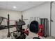 A home gym featuring workout machines, weights, and mirrors to enhance your fitness lifestyle at 5845 W Portland Dr, Littleton, CO 80128