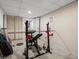 Home gym featuring weight training equipment in a finished basement, ideal for a workout space at 5845 W Portland Dr, Littleton, CO 80128
