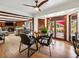 View of dining area with hardwood floors, and view to the outdoor patio at 5845 W Portland Dr, Littleton, CO 80128