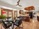 View of dining area with hardwood floors, leading to a bright kitchen at 5845 W Portland Dr, Littleton, CO 80128