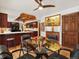 Dining area with wood ceiling, hardwood floors, and view of the kitchen at 5845 W Portland Dr, Littleton, CO 80128