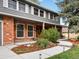 Close-up of the home's brick exterior and landscaped walkway to the front door at 5845 W Portland Dr, Littleton, CO 80128