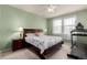 Relaxing bedroom with floral bedding, ceiling fan, and natural light from the windows at 3577 Molly Cir, Broomfield, CO 80023