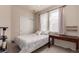 Bright bedroom features a bed, a desk, closet, and a sun-filled window at 3577 Molly Cir, Broomfield, CO 80023
