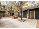 Inviting courtyard entrance featuring a fire pit, mature trees, and access to multiple units at 3577 Molly Cir, Broomfield, CO 80023
