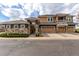 Charming multi-Gathering home featuring stone accents, multiple garages and inviting curb appeal at 3577 Molly Cir, Broomfield, CO 80023