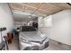 Spacious garage with a silver car parked inside and ample storage space at 3577 Molly Cir, Broomfield, CO 80023