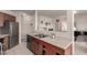 Open kitchen layout with stainless steel appliances, and a pass-through to the living area at 3577 Molly Cir, Broomfield, CO 80023