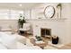 Cozy living room features a decorative fireplace and white decor at 4395 Newland St, Wheat Ridge, CO 80033