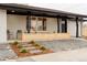 Landscaped front exterior with planter boxes, stepping stones, and charming curb appeal at 4395 Newland St, Wheat Ridge, CO 80033
