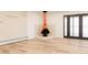 Bright living room showcasing an orange mid-century modern fireplace and access to the patio at 4395 Newland St, Wheat Ridge, CO 80033
