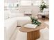 Bright living room featuring a modern white sofa, wood table, and neutral decor creating a cozy and stylish space at 4395 Newland St, Wheat Ridge, CO 80033