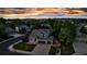 Aerial view of an attractive two-story home features a well-manicured lawn and a three-car garage at 12430 S Downy Creek Ct, Parker, CO 80134