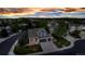 A bird's-eye view of a blue home nestled in a vibrant neighborhood filled with mature trees and greenery at 12430 S Downy Creek Ct, Parker, CO 80134
