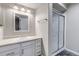 This bathroom features a bright vanity with a white sink and a glass enclosed shower at 12430 S Downy Creek Ct, Parker, CO 80134