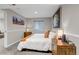 This bedroom offers neutral walls, natural light, and wood nightstands, providing a calm and inviting space at 12430 S Downy Creek Ct, Parker, CO 80134
