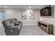 Finished basement living room featuring a leather couch, tv, modern art, carpeted floor, and recessed lights at 12430 S Downy Creek Ct, Parker, CO 80134