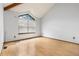 Simple bedroom with large window and hardwood floors providing a clean and airy feel at 942 S Walden St # 204, Aurora, CO 80017