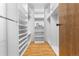 Organized walk-in closet with ample shelving, providing efficient storage and a tidy aesthetic at 942 S Walden St # 204, Aurora, CO 80017