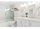 Bright bathroom with a double sink vanity, modern fixtures, and a glass-enclosed shower at 2017 N Fork Dr, Lafayette, CO 80026