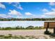 Scenic lake view with snow capped mountains in the distance, blue skies, and seating at 2017 N Fork Dr, Lafayette, CO 80026