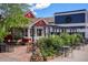 Charming local coffee shop with outdoor seating surrounded by lush greenery and a blue sky at 2017 N Fork Dr, Lafayette, CO 80026