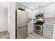 Updated kitchen boasting stainless steel appliances, light gray cabinets, and modern backsplash at 2017 N Fork Dr, Lafayette, CO 80026