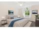 Bright main bedroom featuring a window seat, stylish décor, and modern lighting at 2017 N Fork Dr, Lafayette, CO 80026