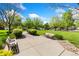 A beautiful park with benches and a walking path is surrounded by lush trees and green grass at 2017 N Fork Dr, Lafayette, CO 80026
