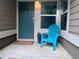 Inviting front porch featuring a blue chair, potted plant, and welcome mat for a warm and friendly entrance at 2017 N Fork Dr, Lafayette, CO 80026