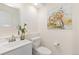 Well-lit powder room with modern vanity and fixtures, and decorative wall art at 2017 N Fork Dr, Lafayette, CO 80026