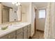 Bathroom features vanity, shower, and window at 1916 S Logan St, Denver, CO 80210