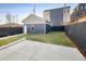 Backyard featuring a small patch of green lawn and a detached two-car garage at 2515 Zenobia St, Denver, CO 80212