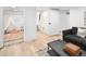 Finished basement area showcasing hardwood floors and stylish decor at 2515 Zenobia St, Denver, CO 80212