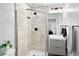 Modern bathroom featuring a glass shower and a sleek vanity with storage at 2515 Zenobia St, Denver, CO 80212