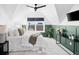 Well-lit bedroom with an accent wall, comfortable bed, and mounted television at 2515 Zenobia St, Denver, CO 80212