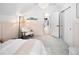 Bedroom with wainscoting, modern lighting and comfortable rocking chair at 2515 Zenobia St, Denver, CO 80212